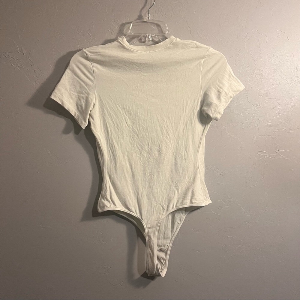 SKIMS Short Sleeve Crew Bodysuit in Ivory Cream - Picture 8 of 16